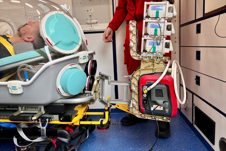 Patient inside an EpiShuttle with infusion pumps attached