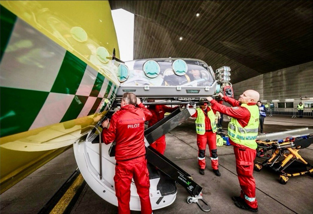 Pilot and crew loading the EpiShuttle into the aircraft